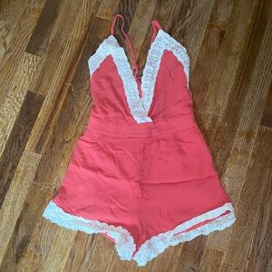 Coral orange romper with lace trimming